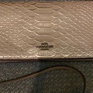 Coach clutch with detachable strap